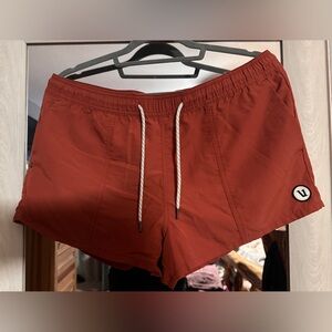 Vuori Women's Shorts in Rust Red